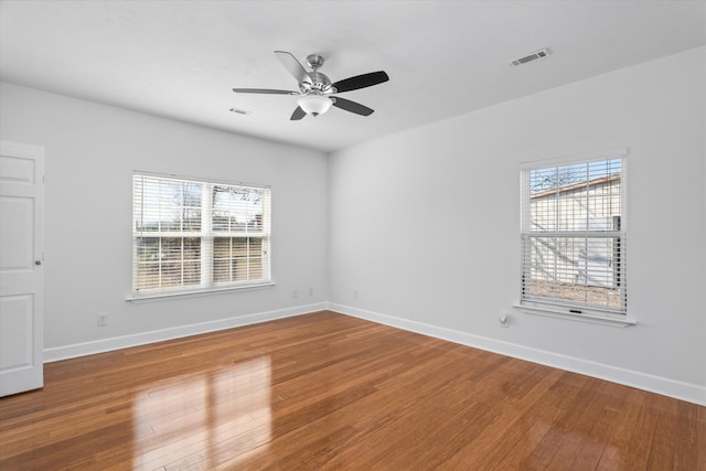 unfurnished room featuring hardwood / wood-style floors and ceiling fan