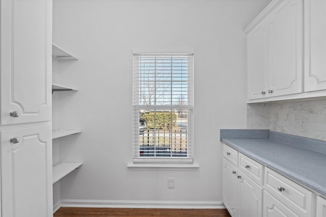 interior space with a healthy amount of sunlight and dark hardwood / wood-style floors