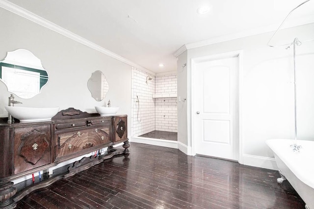 bathroom with vanity, hardwood / wood-style floors, crown molding, and shower with separate bathtub