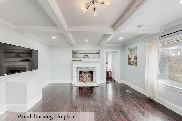 unfurnished living room featuring beamed ceiling, ornamental molding, coffered ceiling, and dark hardwood / wood-style flooring