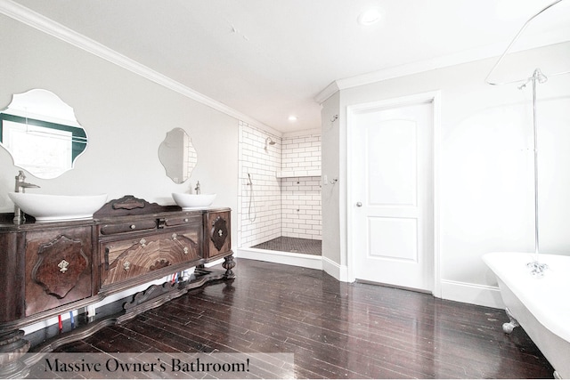 bathroom with ornamental molding, shower with separate bathtub, wood-type flooring, and vanity