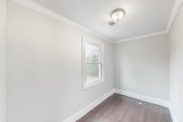 unfurnished room with ornamental molding and dark hardwood / wood-style flooring