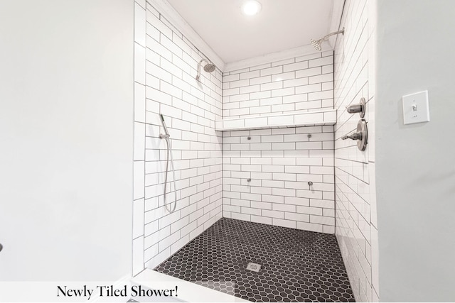 bathroom with a tile shower