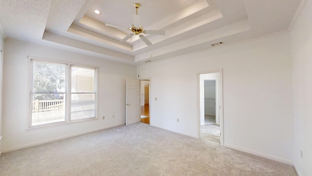4154 Bent Tree Ln, Martinez, GA 30907 - spare room featuring a tray ceiling, light colored carpet, a ceiling fan, and baseboards