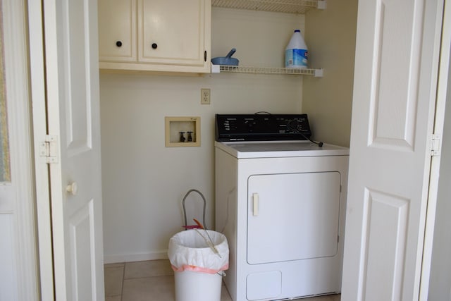 4154 Bent Tree Ln, Martinez, GA 30907 - washroom featuring washer / clothes dryer, cabinet space, light tile patterned flooring, and baseboards