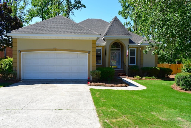 4154 Bent Tree Ln, Martinez, GA 30907 - view of front of house with roof with shingles, driveway, a garage, and stucco siding