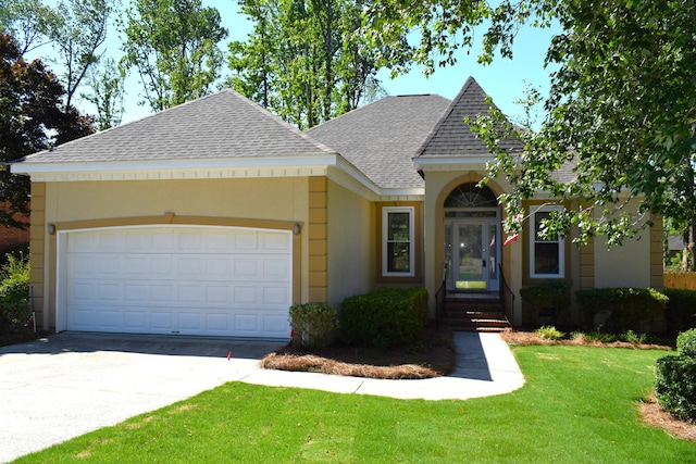 4154 Bent Tree Ln, Martinez, GA 30907 - view of front of house with a shingled roof, a front lawn, concrete driveway, a garage, and stucco siding