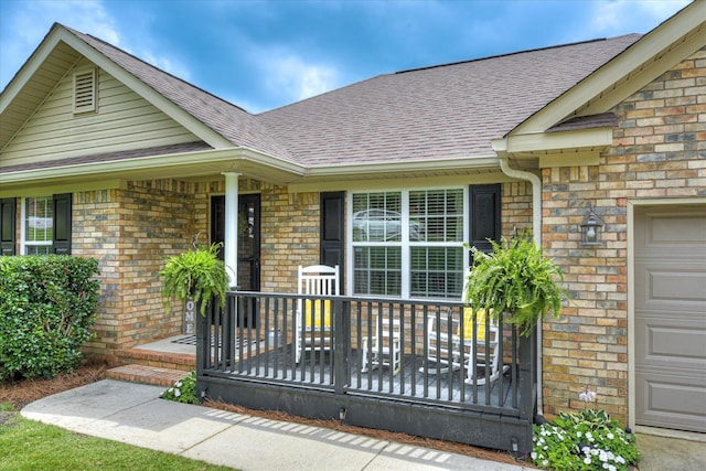 841 High Green Ct, Grovetown, GA 30813 - doorway to property featuring a shingled roof, brick siding, an attached garage, and covered porch