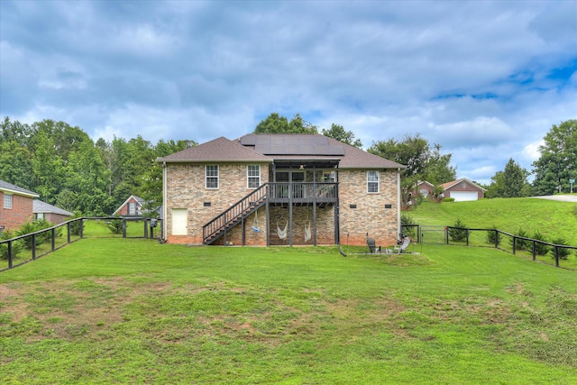 841 High Green Ct, Grovetown, GA 30813 - rear view of house featuring stairs, roof mounted solar panels, a fenced backyard, and a wooden deck