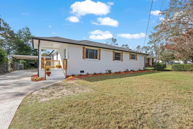 view of front facade with a front lawn and a carport