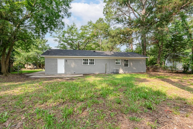 2512 Drayton Dr, Augusta, GA 30906 - rear view of property featuring central AC unit, brick siding, and a patio area