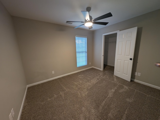 4331 Big Dipper Cir, Hephzibah, GA 30815 - unfurnished bedroom with carpet, a ceiling fan, a spacious closet, and a closet