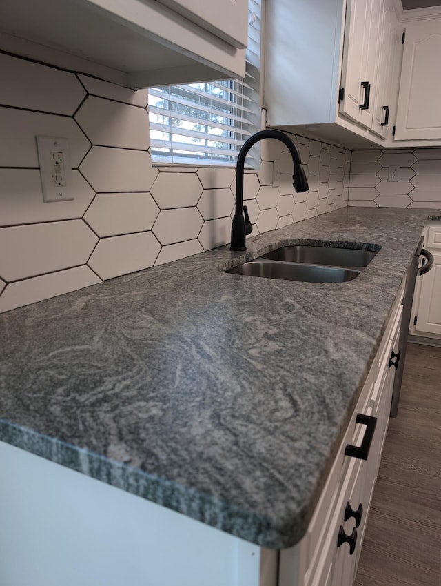 4331 Big Dipper Cir, Hephzibah, GA 30815 - kitchen featuring white cabinetry, decorative backsplash, dark wood-type flooring, and dark stone counters