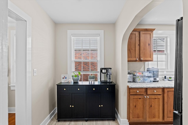 1216 Heard Ave, Augusta, GA 30904 - bar featuring arched walkways and freestanding refrigerator