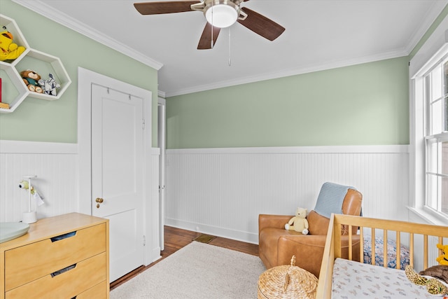 1216 Heard Ave, Augusta, GA 30904 - bedroom featuring a wainscoted wall, wood finished floors, ornamental molding, and ceiling fan