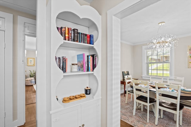 1216 Heard Ave, Augusta, GA 30904 - dining space with crown molding, a chandelier, and wood finished floors