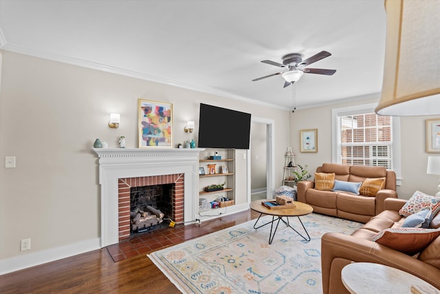 1216 Heard Ave, Augusta, GA 30904 - living area featuring a ceiling fan, dark wood-style flooring, crown molding, and a brick fireplace