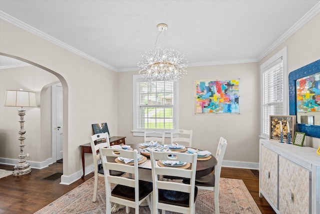 1216 Heard Ave, Augusta, GA 30904 - dining space featuring arched walkways, dark wood-style flooring, crown molding, and a chandelier