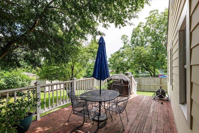 1216 Heard Ave, Augusta, GA 30904 - deck with outdoor dining space, a grill, and a fenced backyard