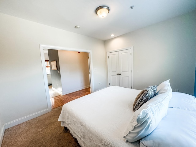 carpeted bedroom featuring a closet