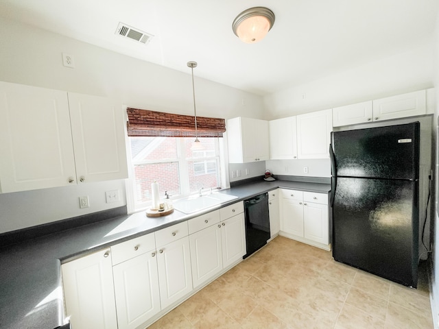 kitchen with sink, black appliances, pendant lighting, white cabinets, and light tile patterned flooring