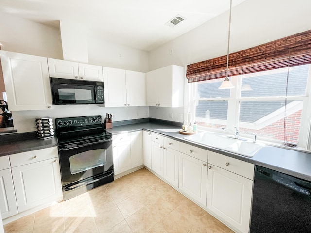 kitchen with white cabinetry, sink, black appliances, and decorative light fixtures