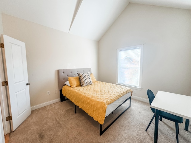 bedroom with light colored carpet and lofted ceiling