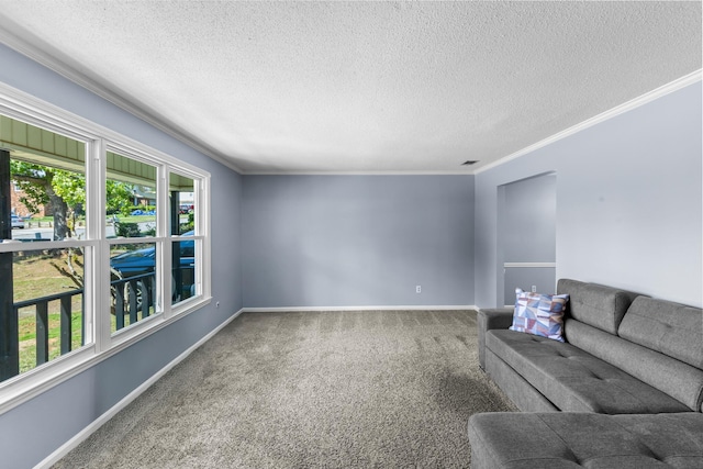 unfurnished living room with baseboards, carpet, a textured ceiling, and ornamental molding