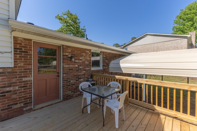 wooden deck with outdoor dining area