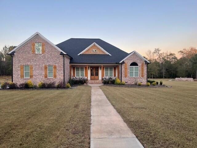 view of front of house with a yard