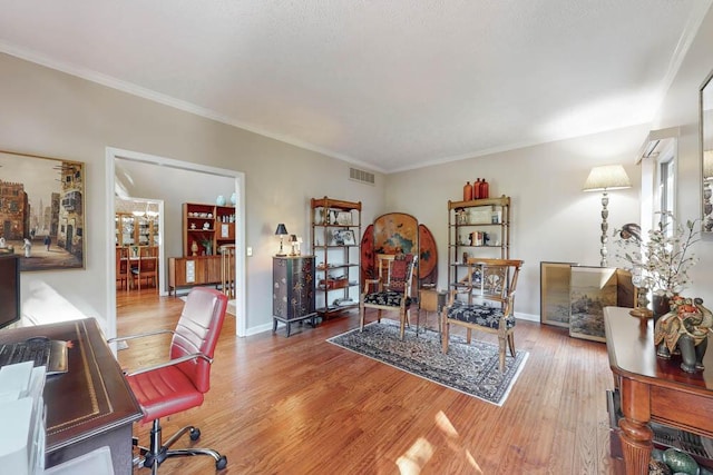 living room featuring ornamental molding and hardwood / wood-style floors