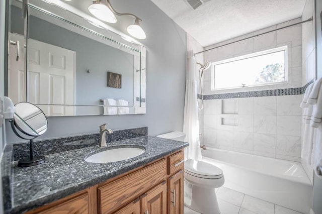 full bathroom featuring shower / tub combo with curtain, tile patterned floors, toilet, a textured ceiling, and vanity