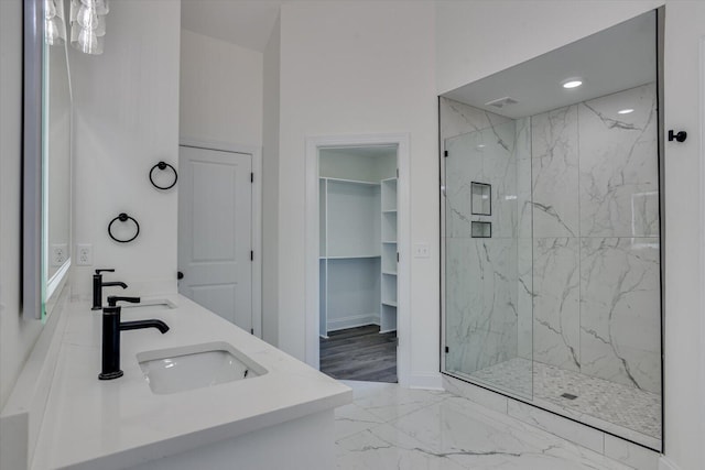 bathroom featuring vanity and a shower with shower door