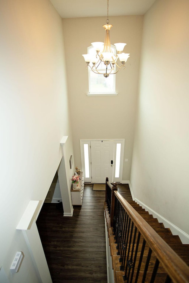 1144 George W Crawford Dr, Augusta, GA 30909 - foyer entrance with baseboards, a chandelier, dark wood finished floors, stairs, and a high ceiling