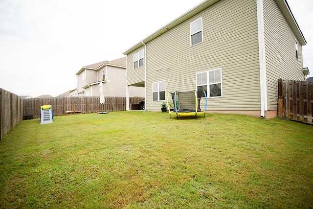 1144 George W Crawford Dr, Augusta, GA 30909 - rear view of house with a trampoline