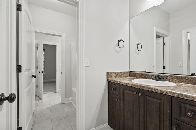 4752 Storey Mill Rd, Hephzibah, GA 30815 - bathroom with vanity, marble look tiles, and a tub
