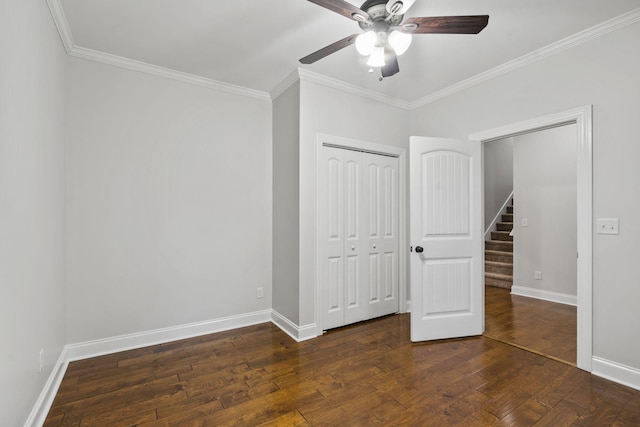 4752 Storey Mill Rd, Hephzibah, GA 30815 - unfurnished bedroom featuring crown molding, a closet, dark wood-style floors, and ceiling fan