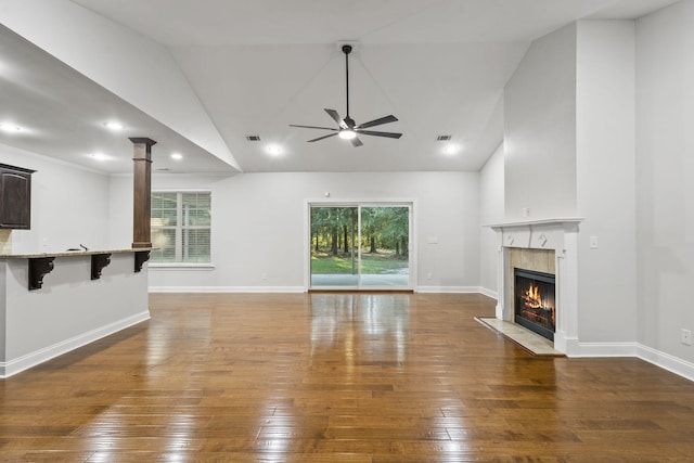 4752 Storey Mill Rd, Hephzibah, GA 30815 - unfurnished living room with ceiling fan, a premium fireplace, hardwood / wood-style flooring, high vaulted ceiling, and decorative columns