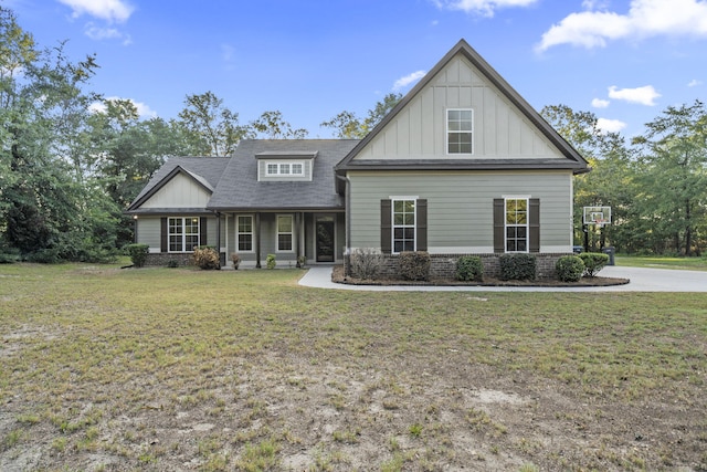 4752 Storey Mill Rd, Hephzibah, GA 30815 - craftsman-style house with board and batten siding, a front lawn, and roof with shingles