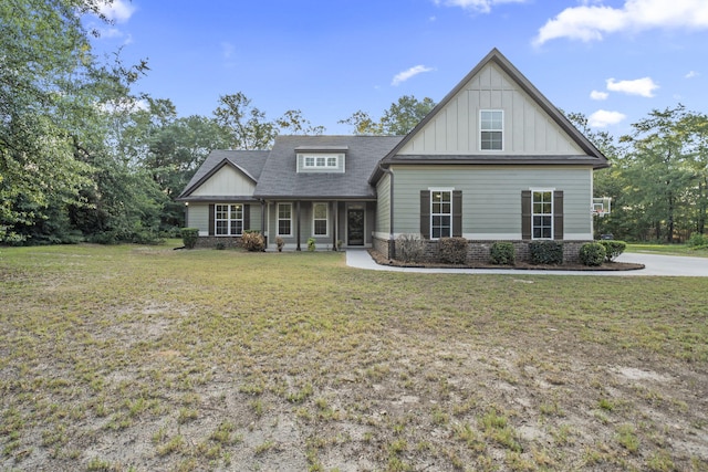 4752 Storey Mill Rd, Hephzibah, GA 30815 - craftsman-style home featuring board and batten siding, a front lawn, and a shingled roof
