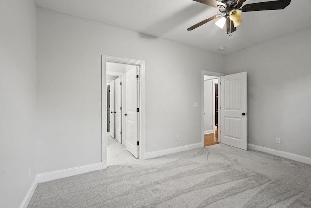 4752 Storey Mill Rd, Hephzibah, GA 30815 - unfurnished bedroom featuring light carpet, ceiling fan, and connected bathroom