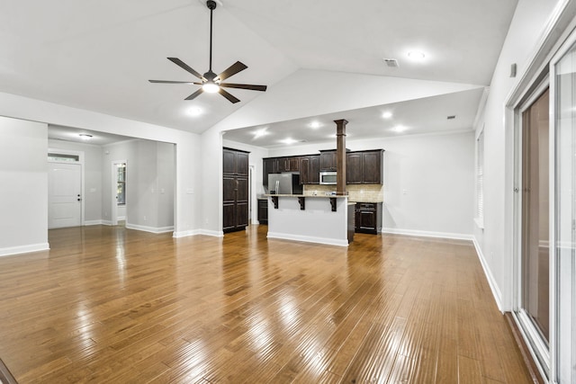 4752 Storey Mill Rd, Hephzibah, GA 30815 - unfurnished living room featuring a ceiling fan, wood finished floors, vaulted ceiling, and recessed lighting