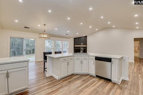 kitchen featuring dishwasher, a kitchen island, white cabinetry, and sink