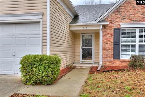 property entrance with a garage