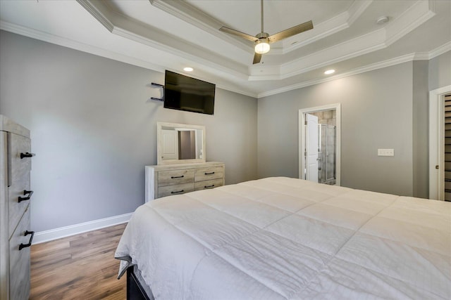 7054 Rance Perry Rd, Appling, GA 30802 - bedroom with ornamental molding, a tray ceiling, baseboards, and wood finished floors