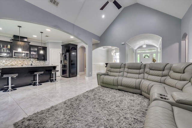 7054 Rance Perry Rd, Appling, GA 30802 - living area with crown molding, visible vents, ceiling fan, arched walkways, and bar