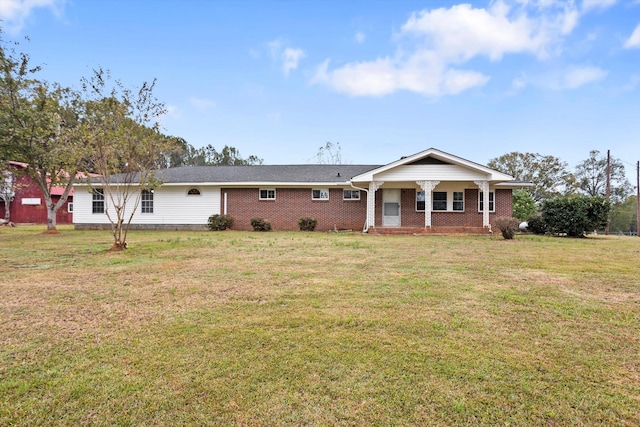 view of front of house featuring a porch and a front lawn