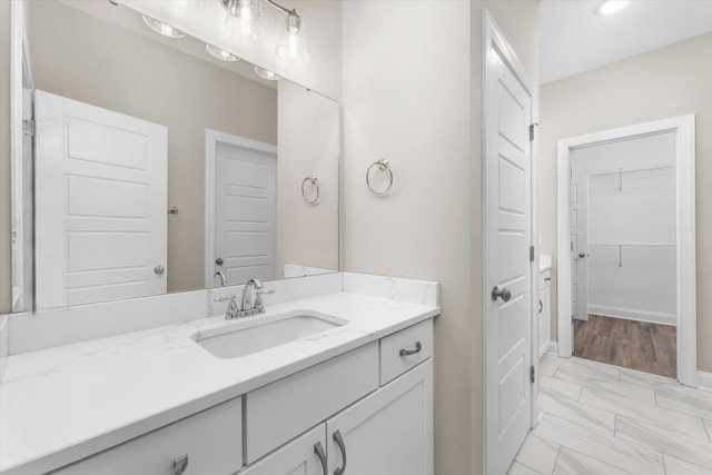 5921 Big Pond Trl, Grovetown, GA 30813 - bathroom with vanity, marble finish floors, and a spacious closet