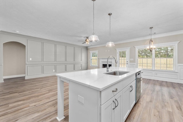 5921 Big Pond Trl, Grovetown, GA 30813 - kitchen featuring a decorative wall, ceiling fan, light wood-style flooring, ornamental molding, and arched walkways
