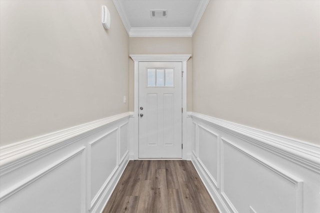 5921 Big Pond Trl, Grovetown, GA 30813 - doorway to outside with crown molding, wainscoting, dark wood finished floors, and a decorative wall